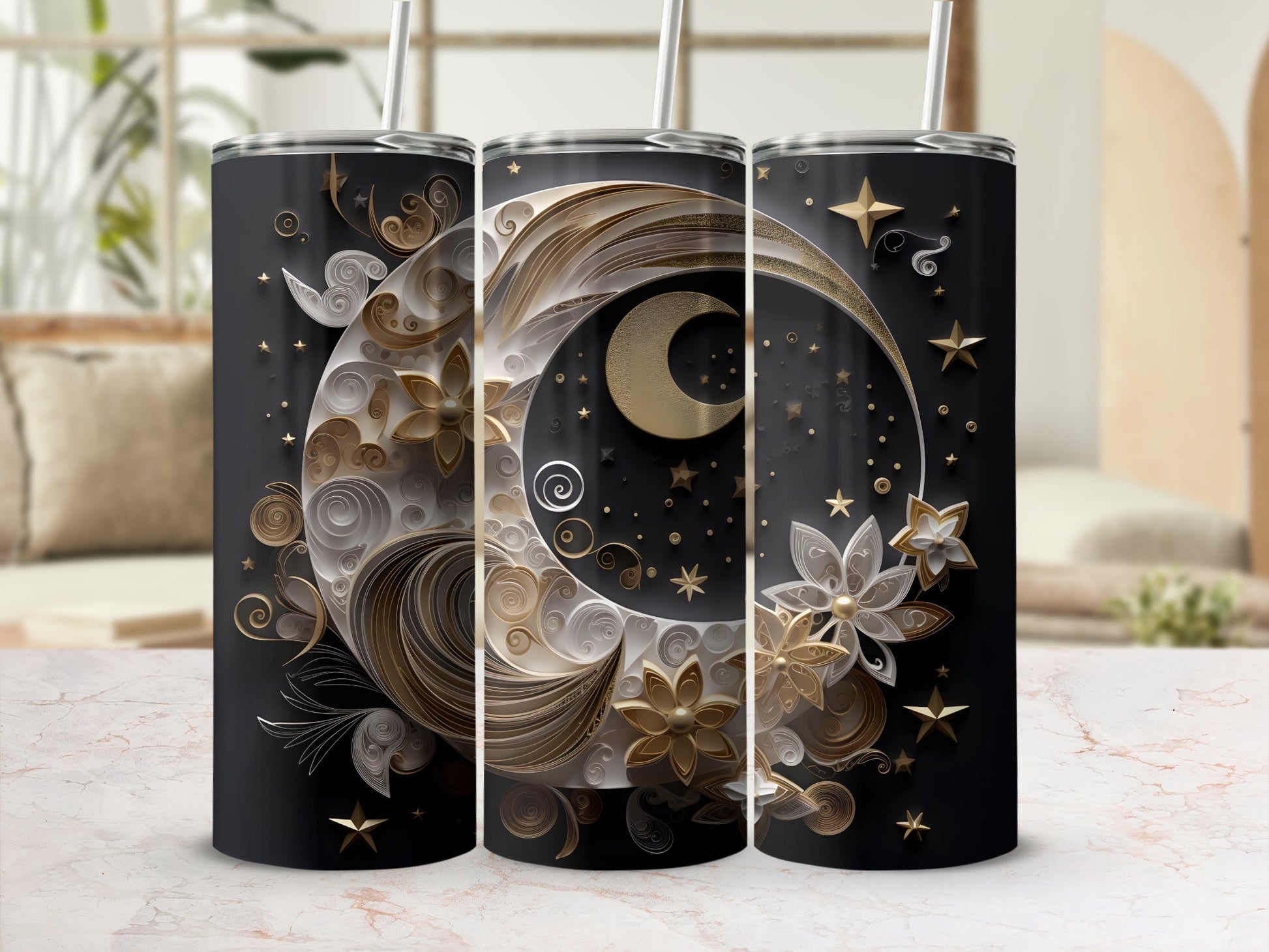 Three black tumblers with gold celestial moon and star designs.