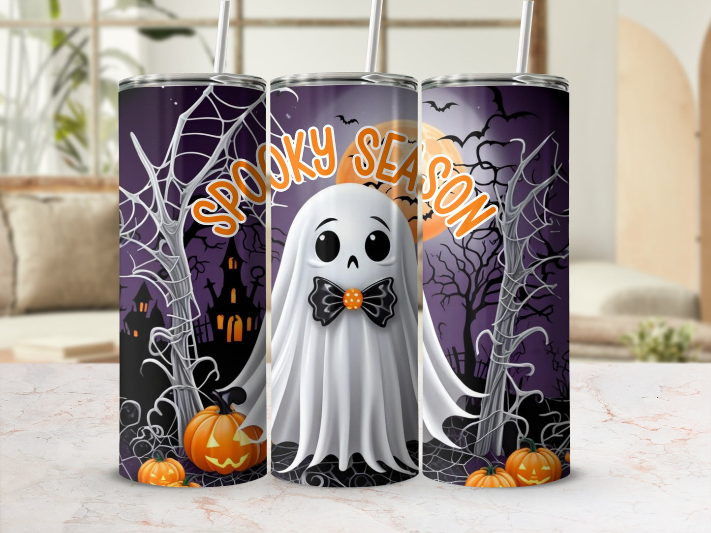 Tumbler with ghost, pumpkins, and "Spooky Season" text on a Halloween-themed background.
