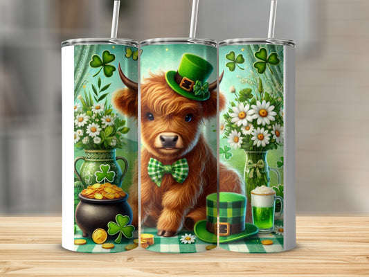 Highland cow in green hat with shamrocks and pot of gold.