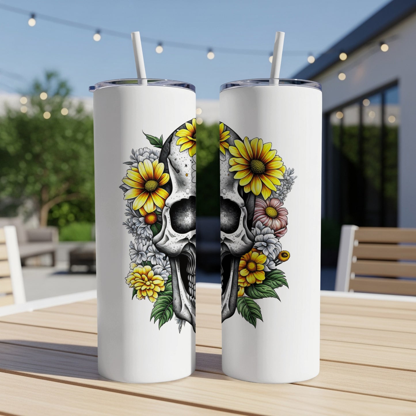 Two white tumblers with split skull and floral designs.