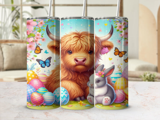Highland cow and bunny with Easter eggs and butterflies on a tumbler.