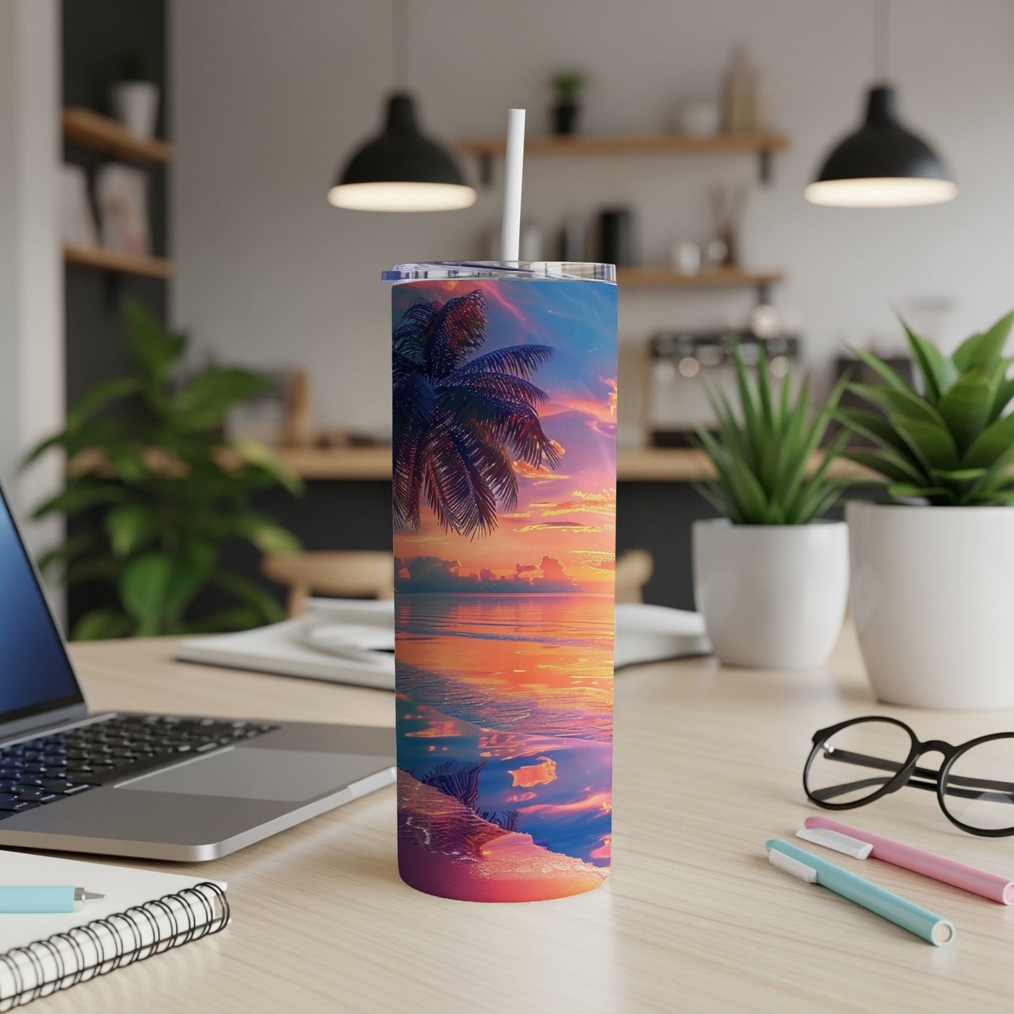 Tropical sunset reflected on water with palm tree silhouette on a tumbler.