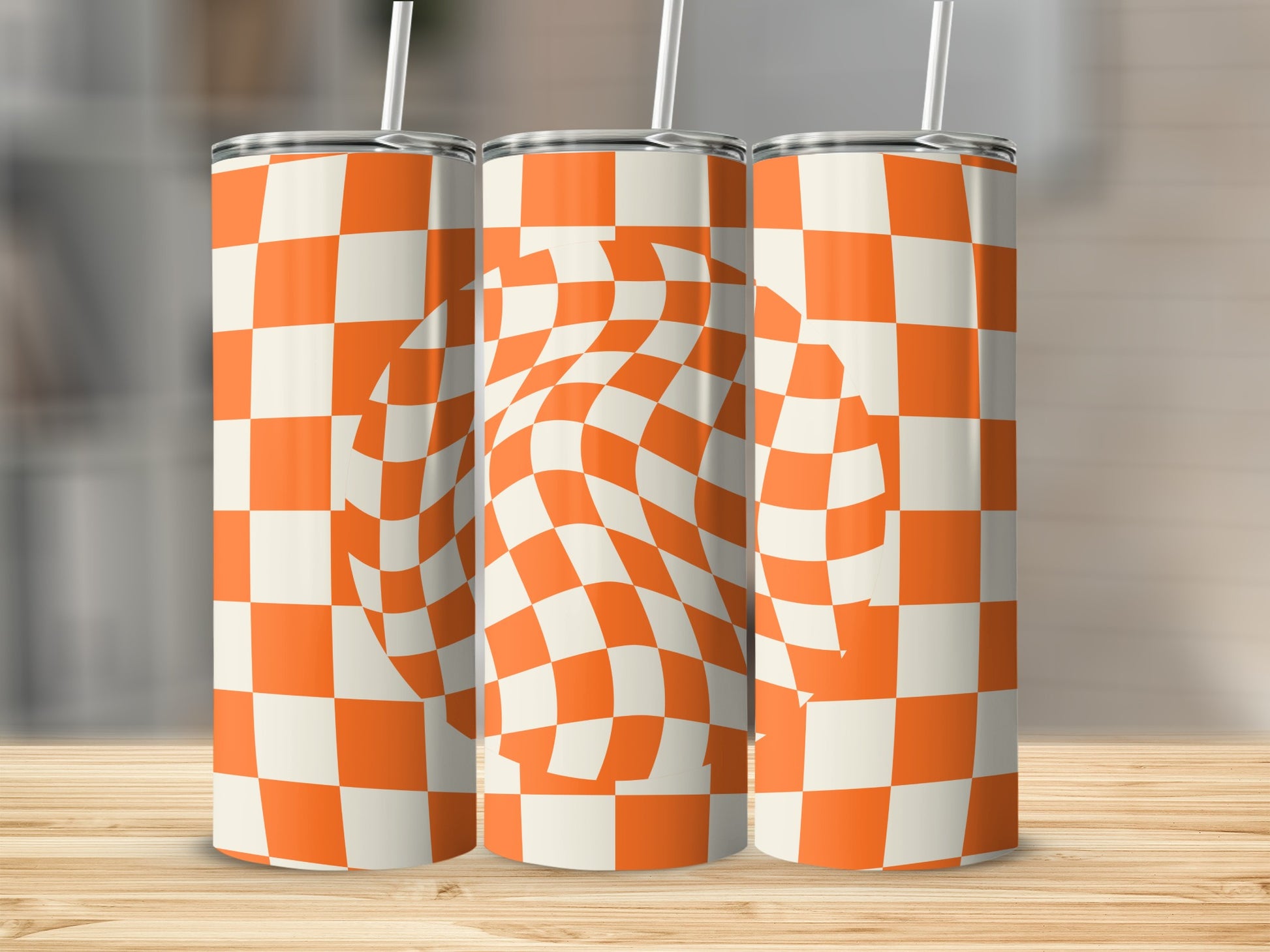 Three tall tumblers with orange and white checkerboard pattern and warped center.