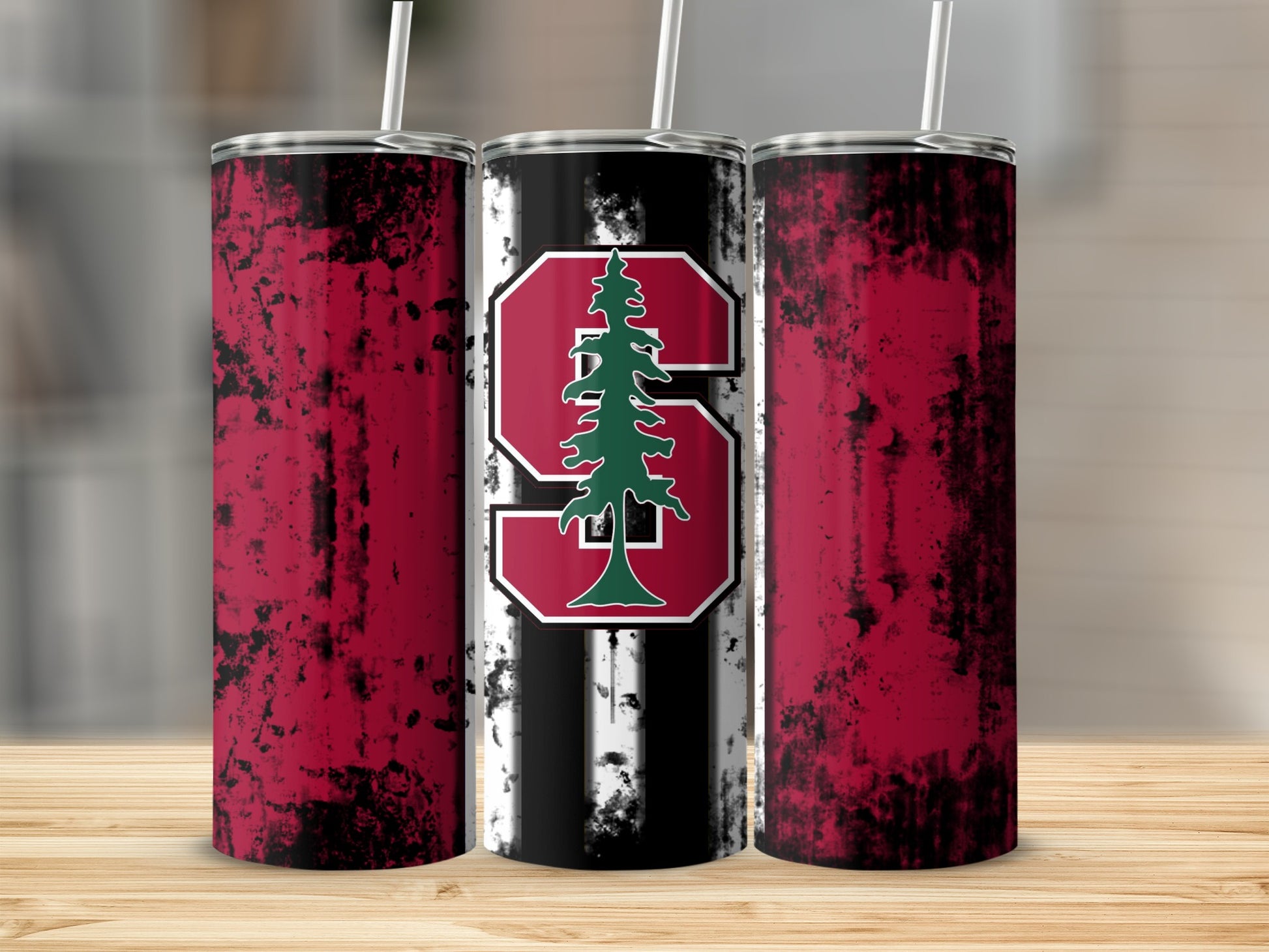 Tumblers with distressed red and black design and a central Stanford S logo with a tree.