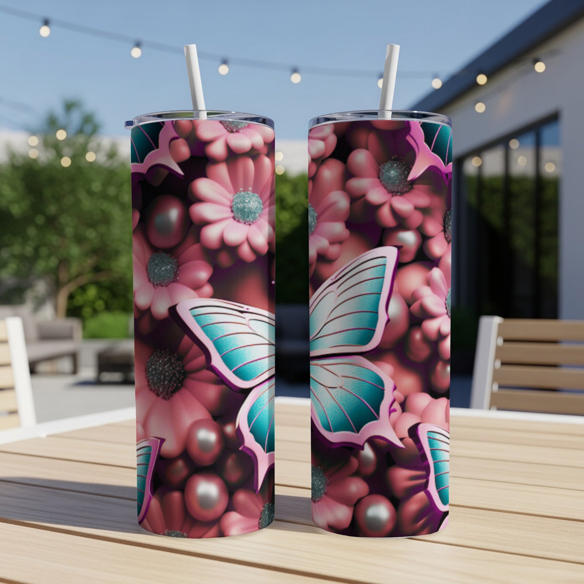 Two tumblers with a butterfly and floral pattern, on a wooden table.