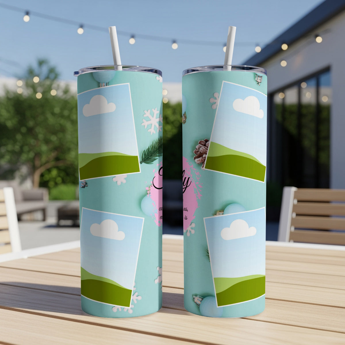 Two tumblers with pastel blue background, scattered snowflakes, and framed landscape images.