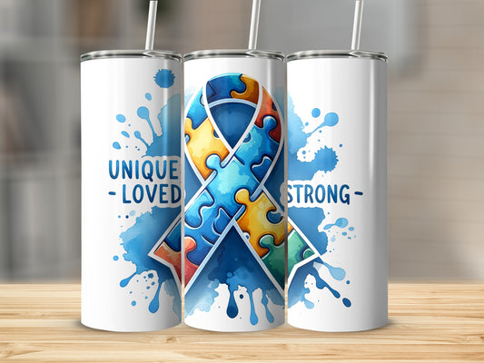 White tumblers with blue watercolor puzzle ribbon and text "UNIQUE - LOVED - STRONG".