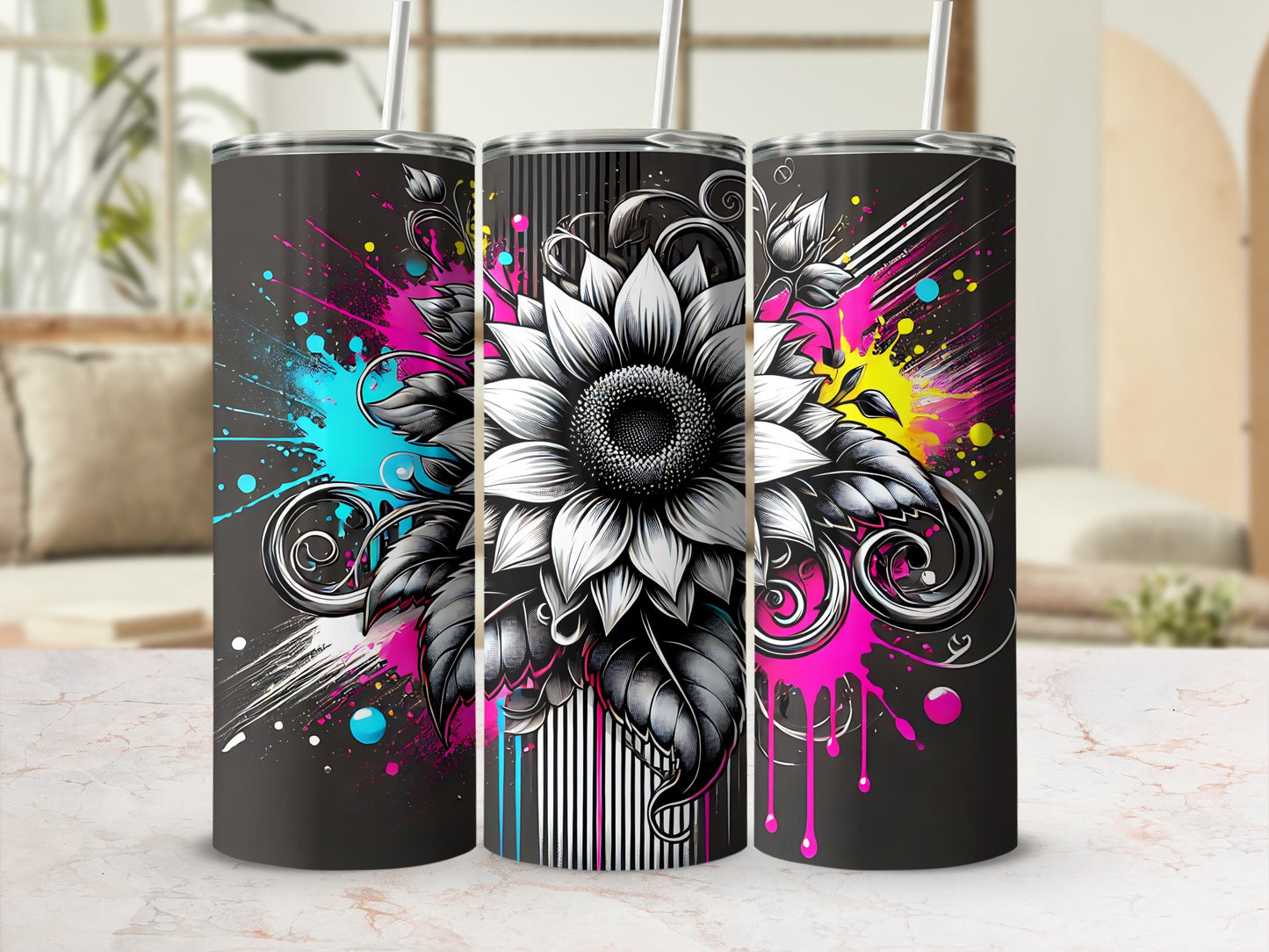 Three black tumblers with a detailed sunflower design and colorful paint splatters.