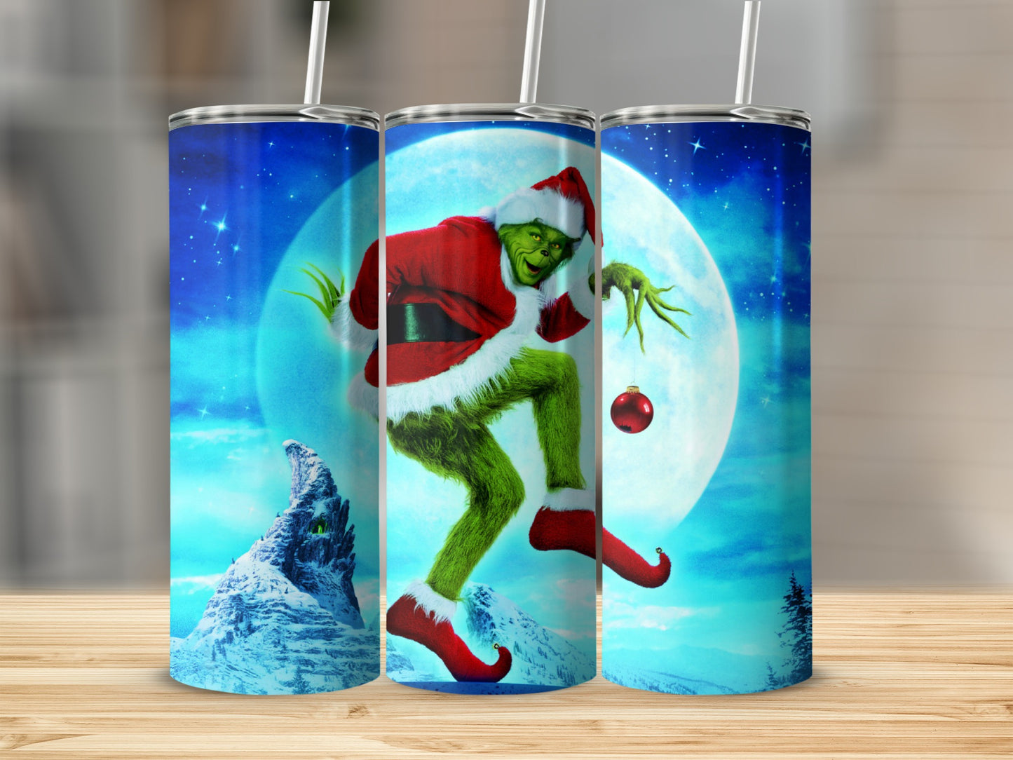 Grinch in Santa costume holding ornament against moonlit winter scene.
