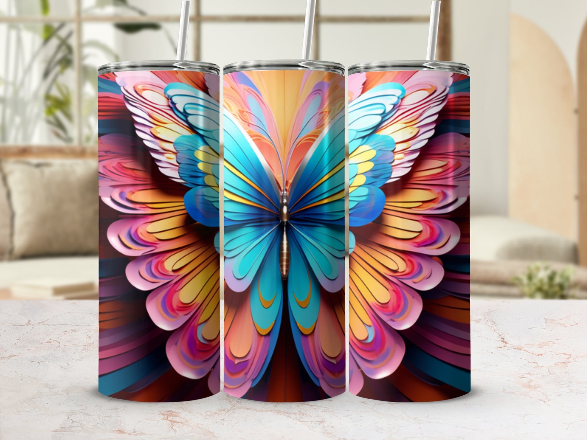 Three tumblers decorated with a colorful, abstract butterfly wing design.