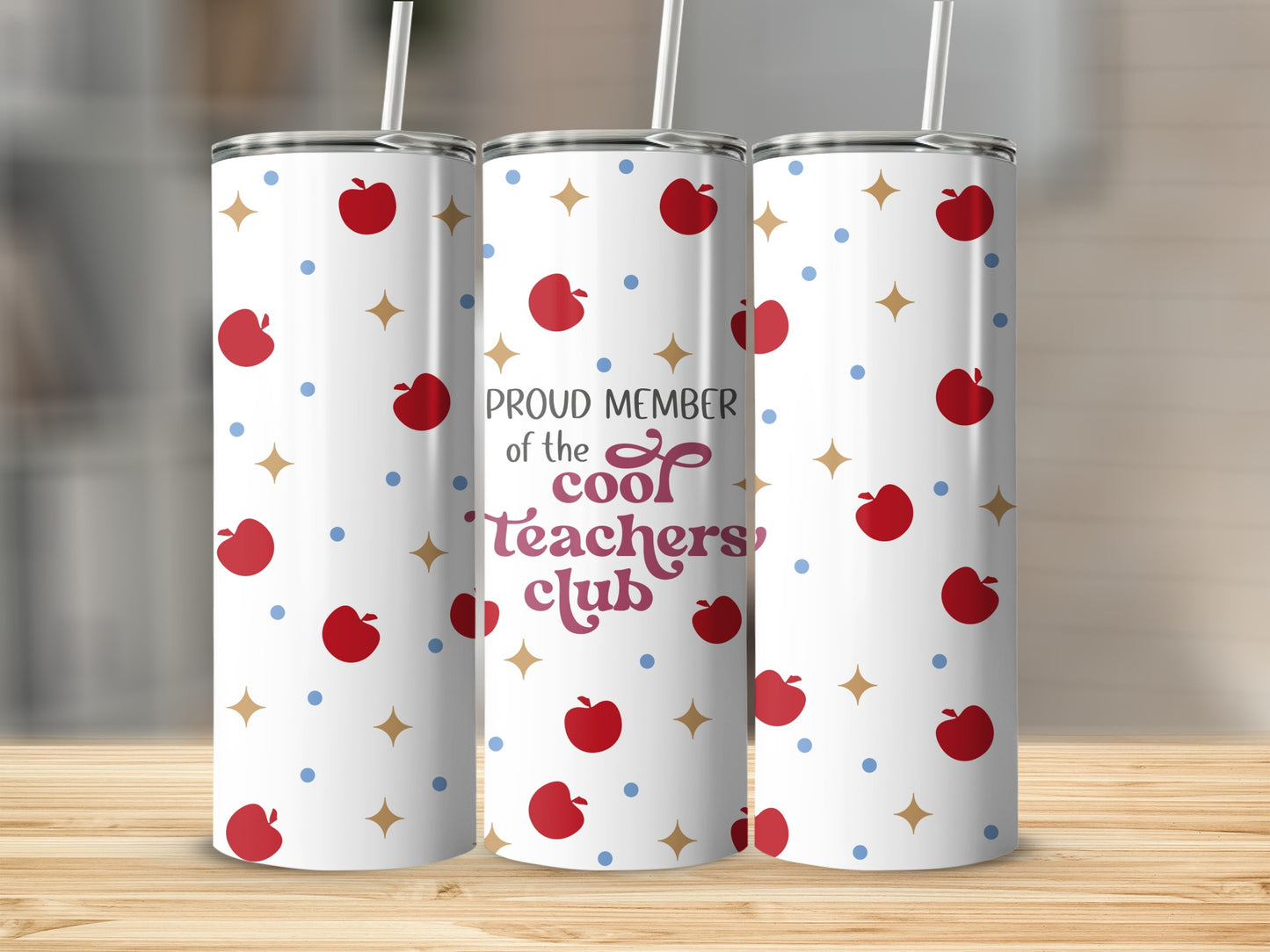 White tumbler with apples, stars, and "Proud Member of the Cool Teachers Club" text.