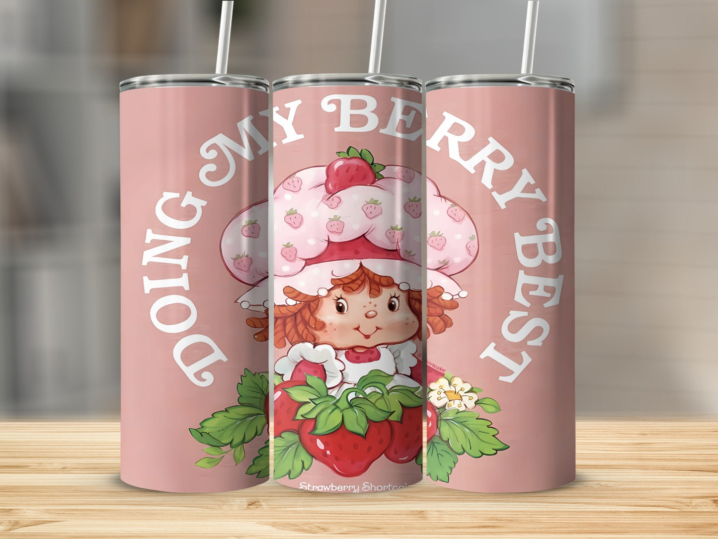 Strawberry Shortcake character on pink tumbler with "Doing My Berry Best" text.