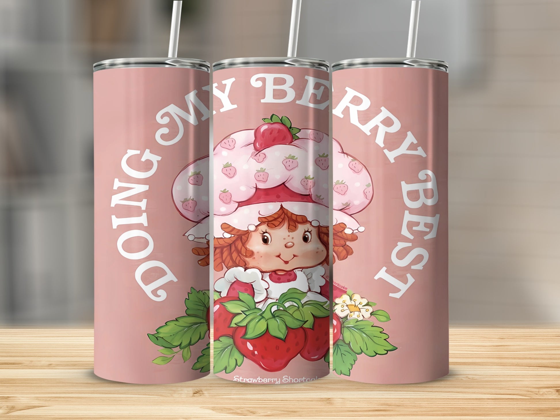 Strawberry Shortcake character on pink tumbler with "Doing My Berry Best" text.
