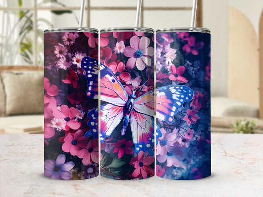 Three tumblers with a butterfly and floral design on a marble surface.