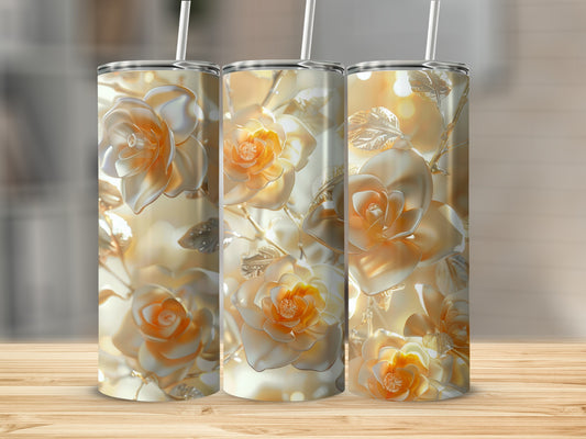 Three gold-toned tumblers with embossed rose floral patterns stand on a wooden surface.