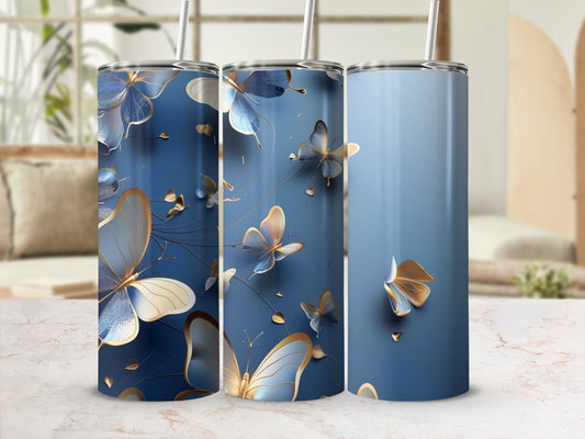 Three blue tumblers with gold butterflies and floral accents.
