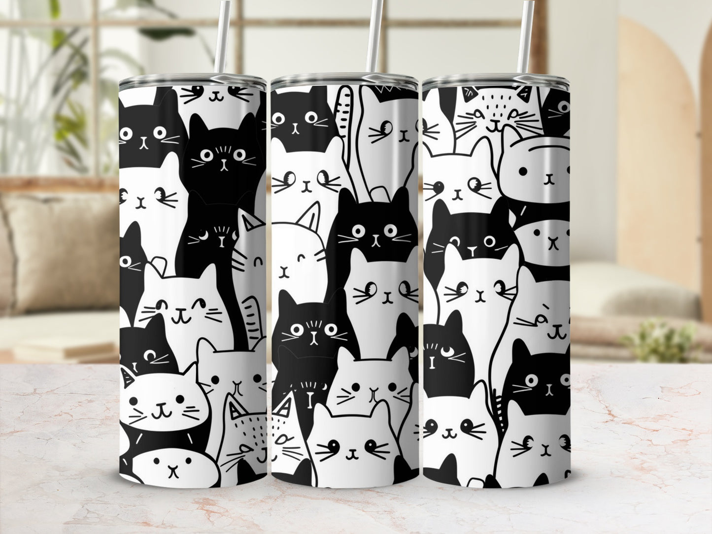 White tumbler with repeating pattern of black and white cartoon cats.