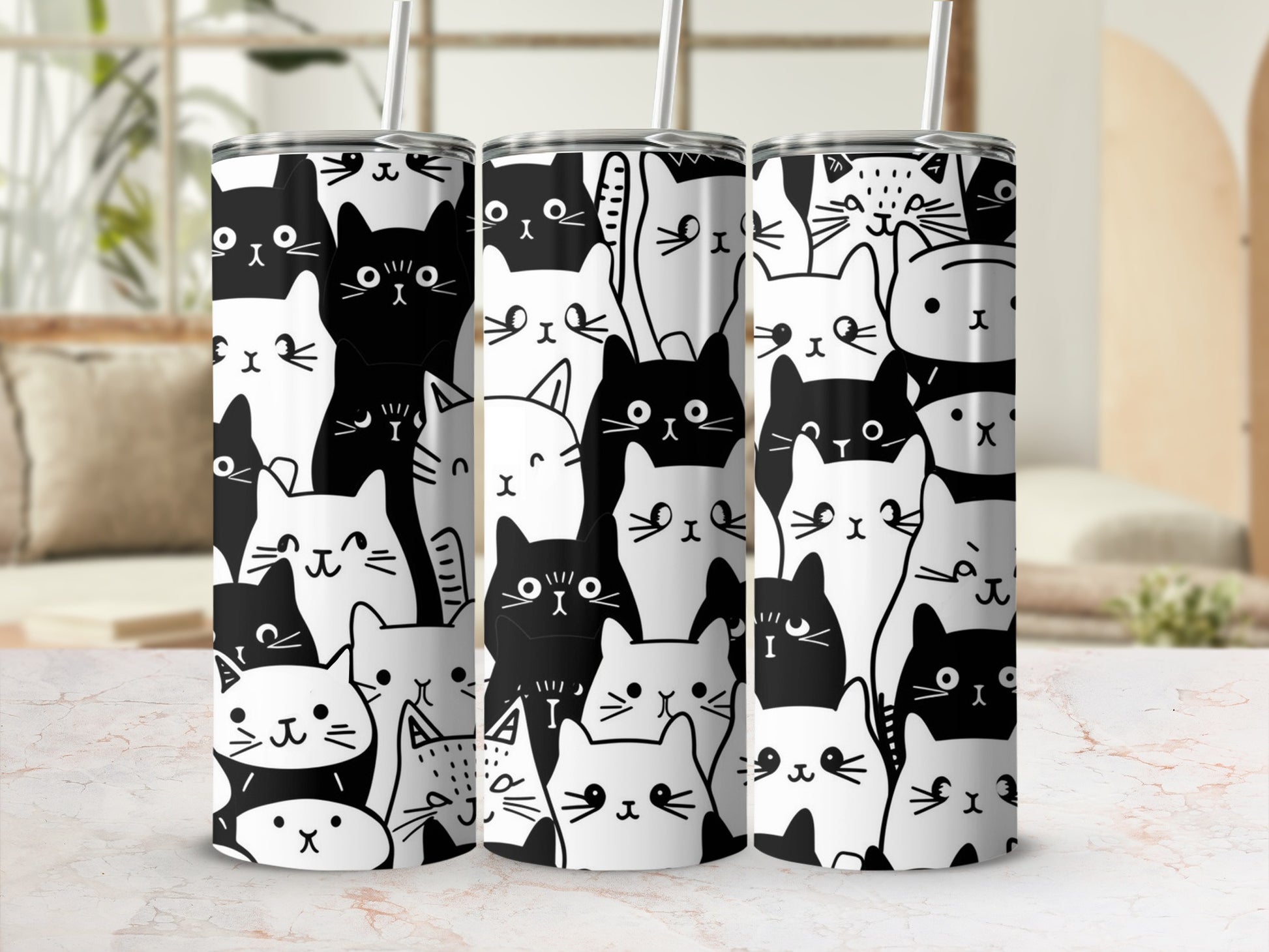 White tumbler with repeating pattern of black and white cartoon cats.
