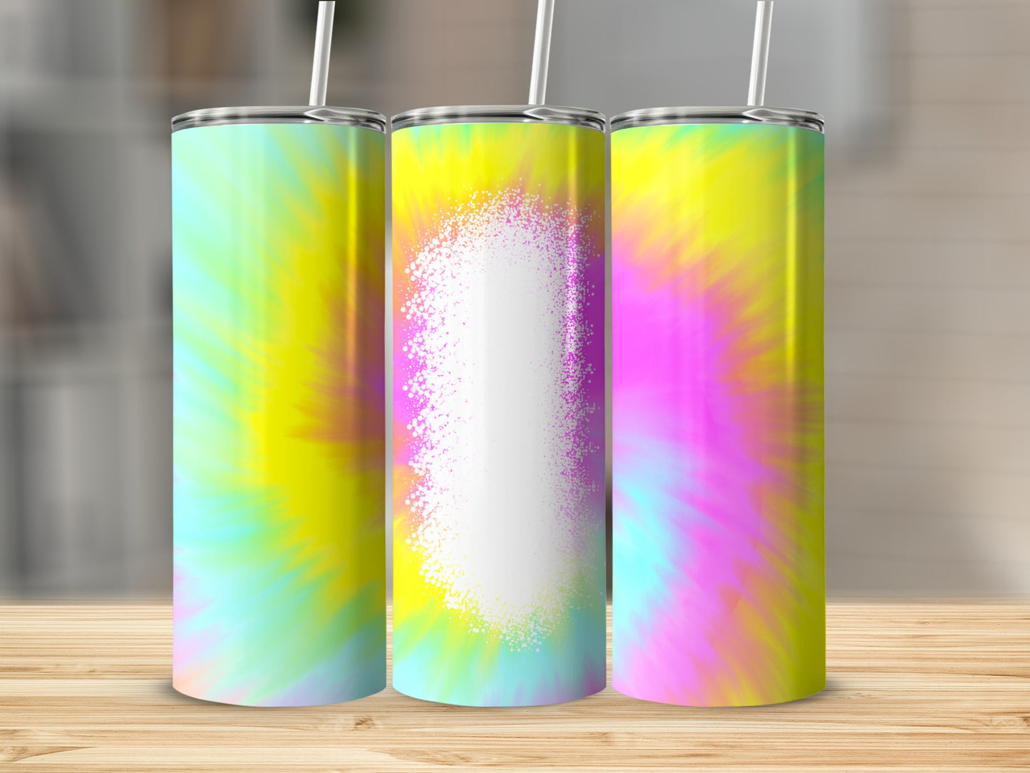 Three tie-dye tumblers with a white splatter design in the center.