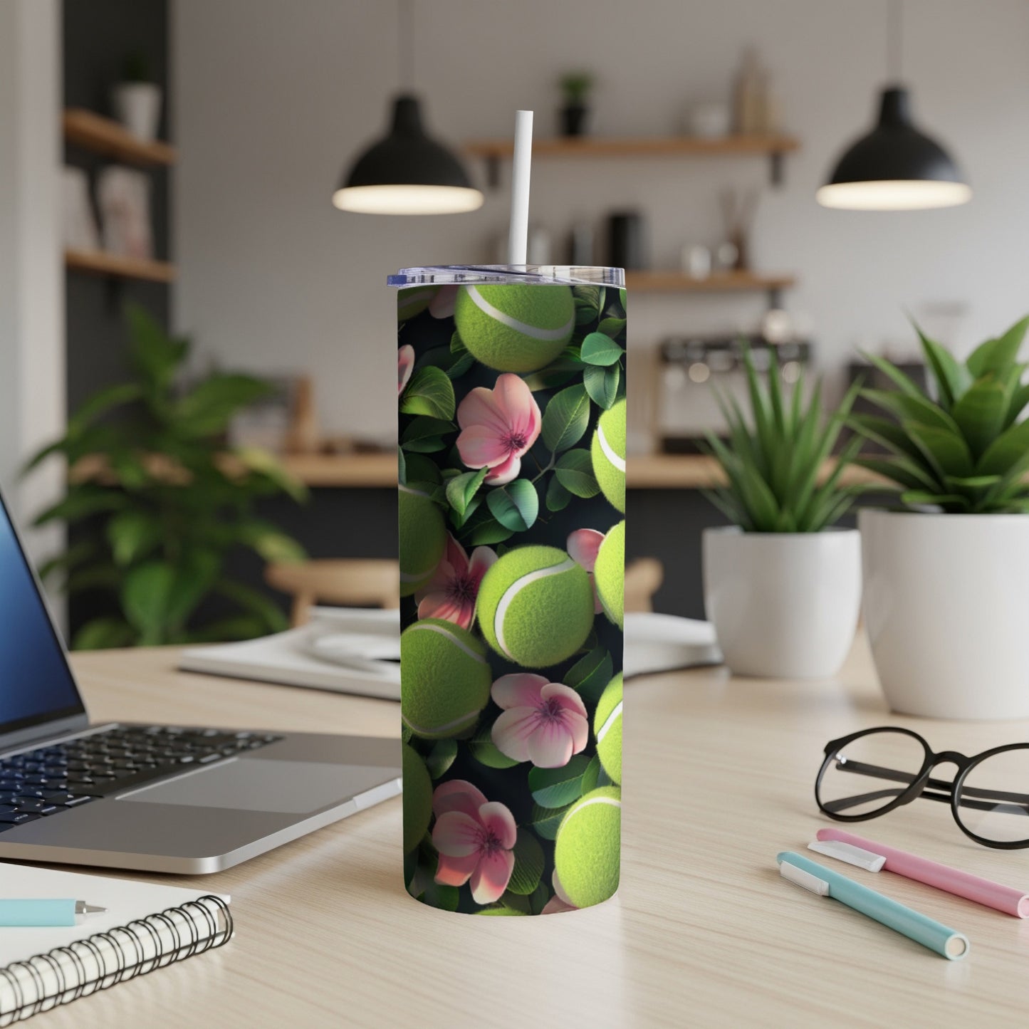 Tennis balls and pink flowers pattern on a tumbler.
