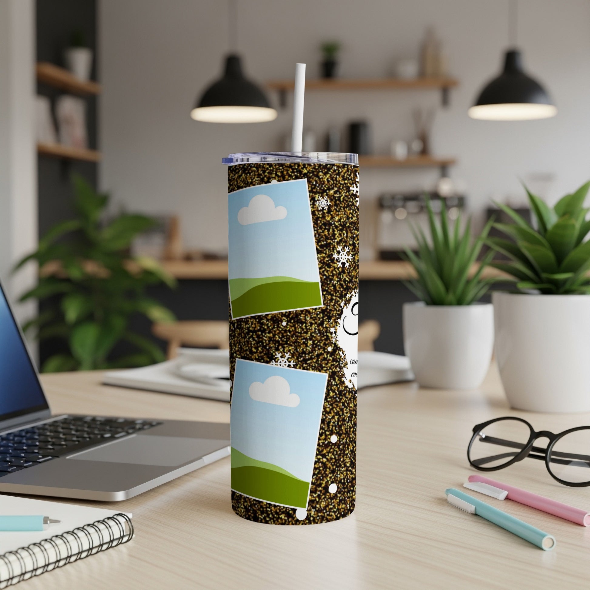 Tumbler with glitter, snowflakes, and two photo frames, one above the other.