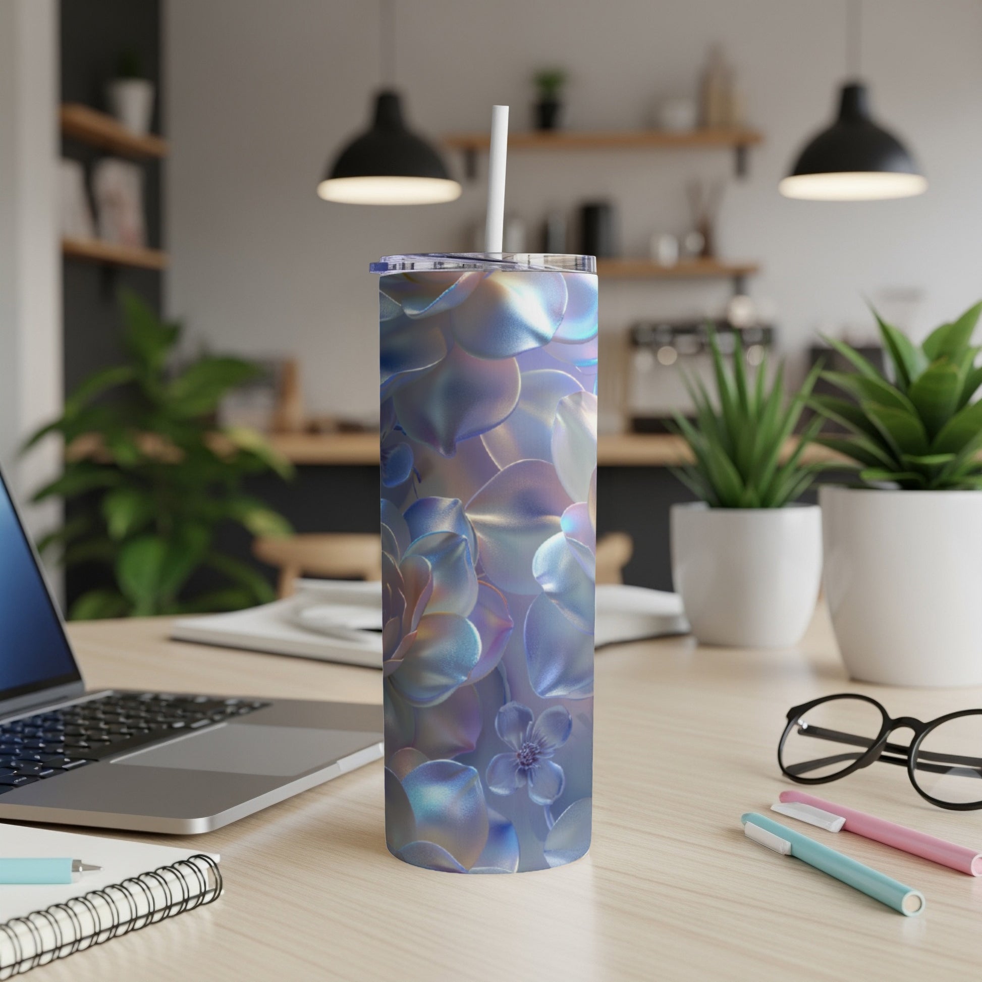 Iridescent succulent floral pattern on a stainless steel tumbler with straw.