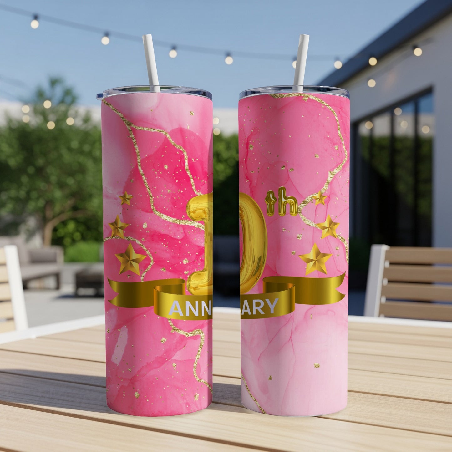 Pink marble tumbler with gold "50th Anniversary" text on a ribbon.