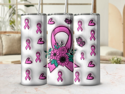 Pink breast cancer awareness ribbons and flowers adorn a white tumbler.
