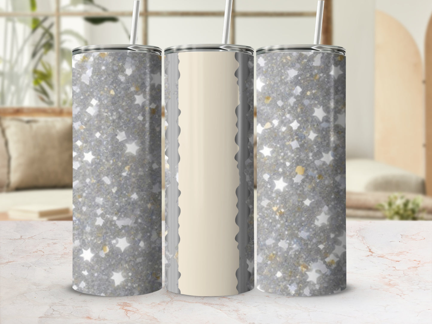Three glittery tumblers with gold star accents, one with a cream panel.