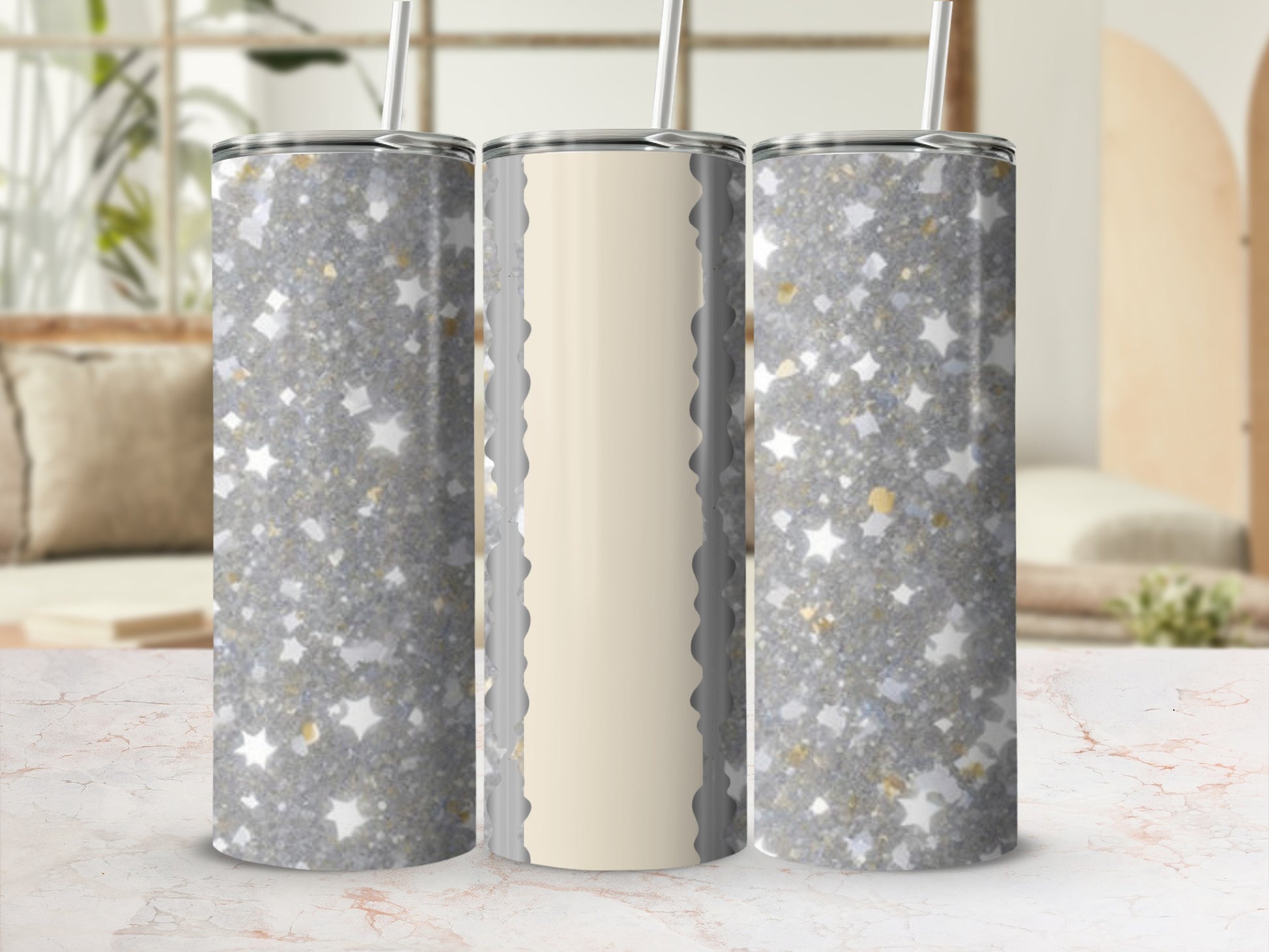 Three glittery tumblers with gold star accents, one with a cream panel.