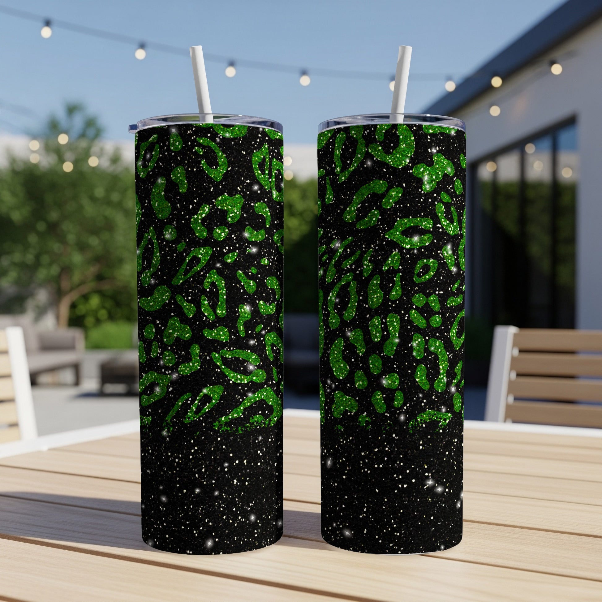 Black tumbler with green glitter leopard print and white specks.