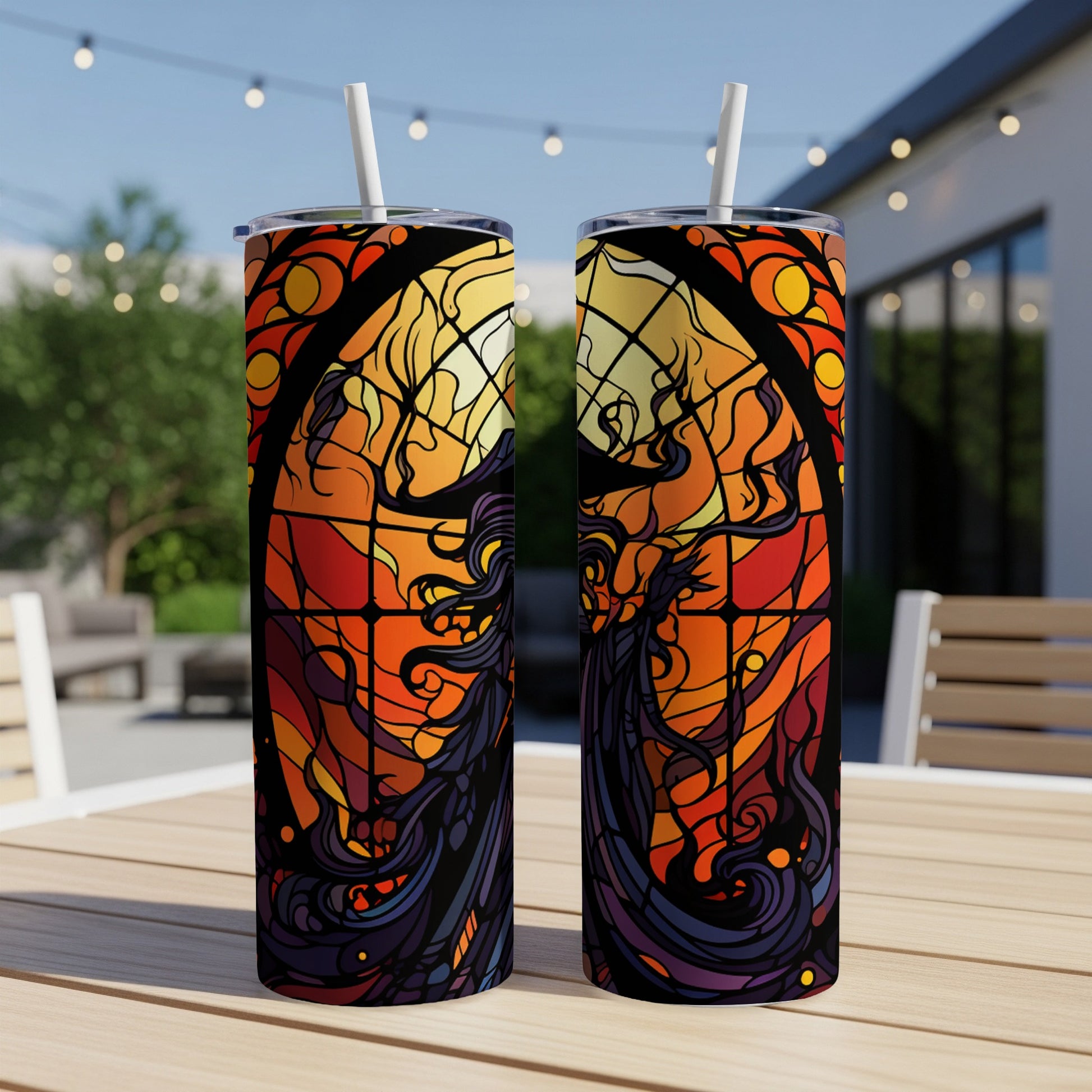 Two tumblers featuring stained glass design of a woman with flowing hair.