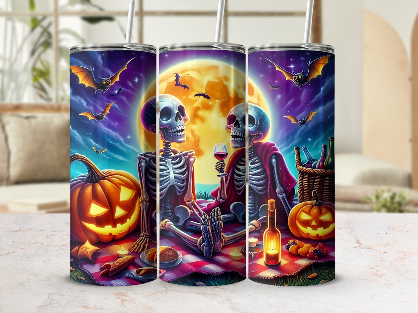 Halloween tumblers with skeletons, pumpkins, bats, and a full moon.