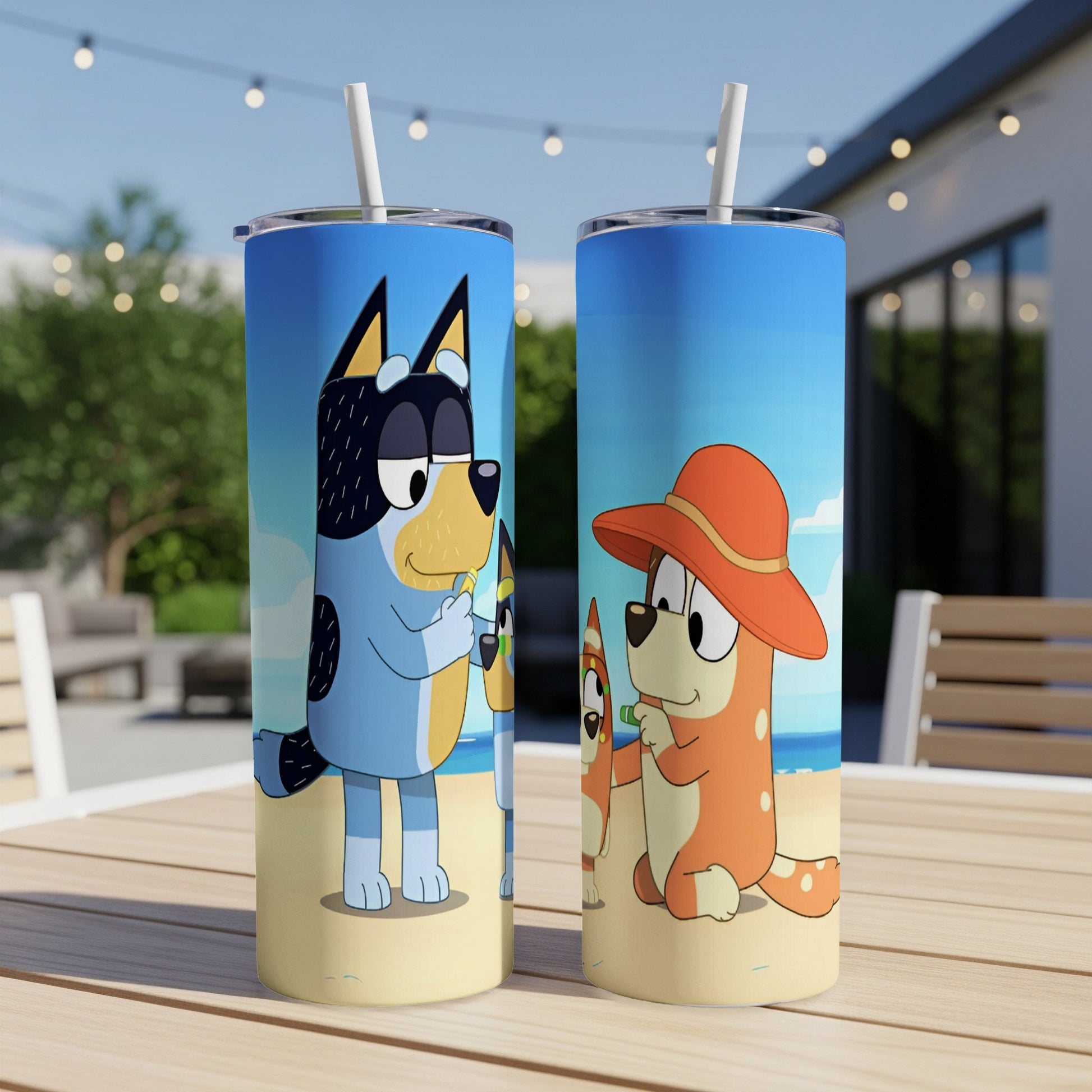 Bluey and Bingo characters from the TV show on a beach scene tumbler.