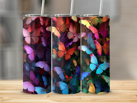 Three tumblers with vibrant butterfly designs in various colors.