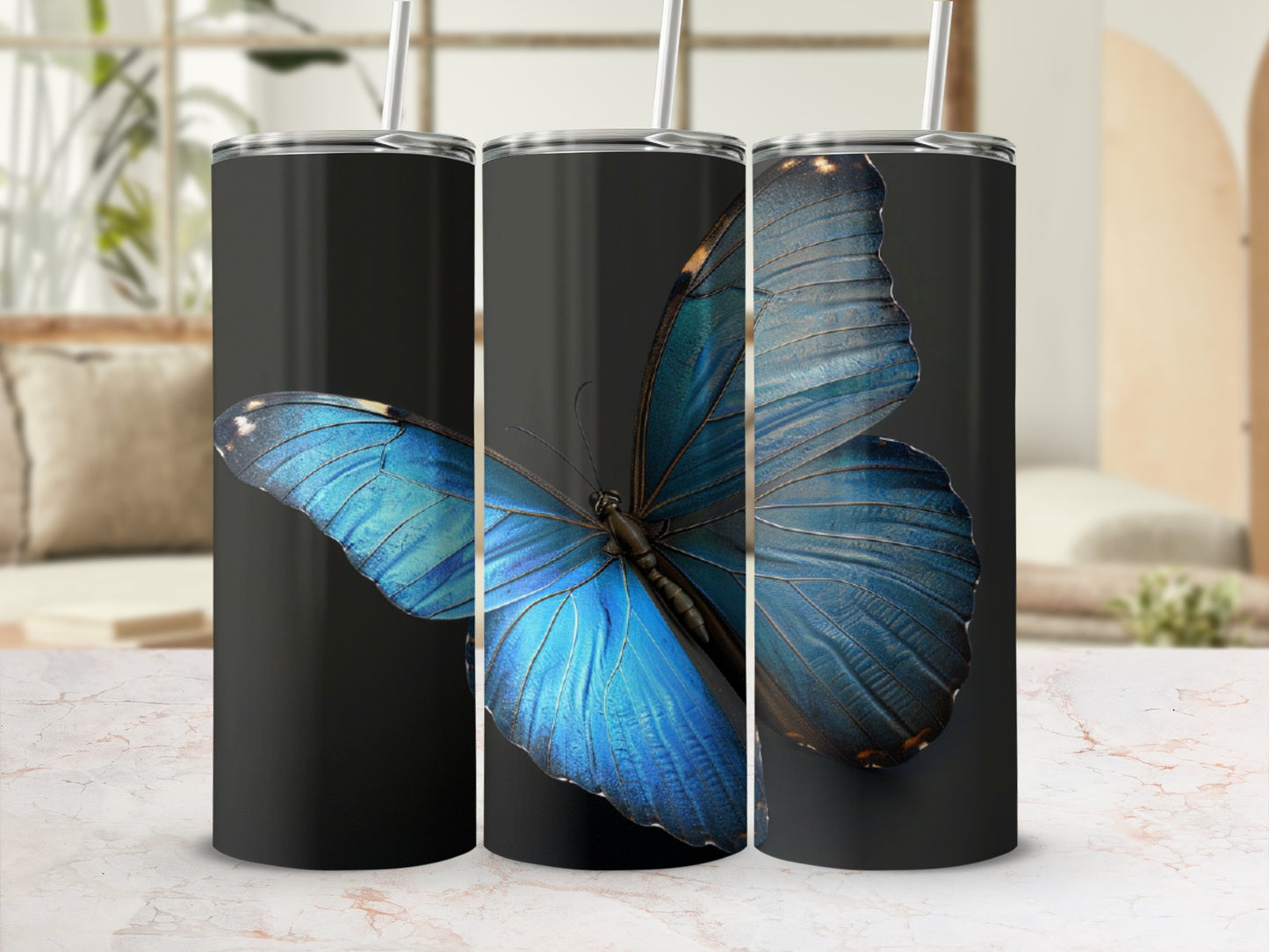 Three black tumblers with a large blue butterfly graphic.