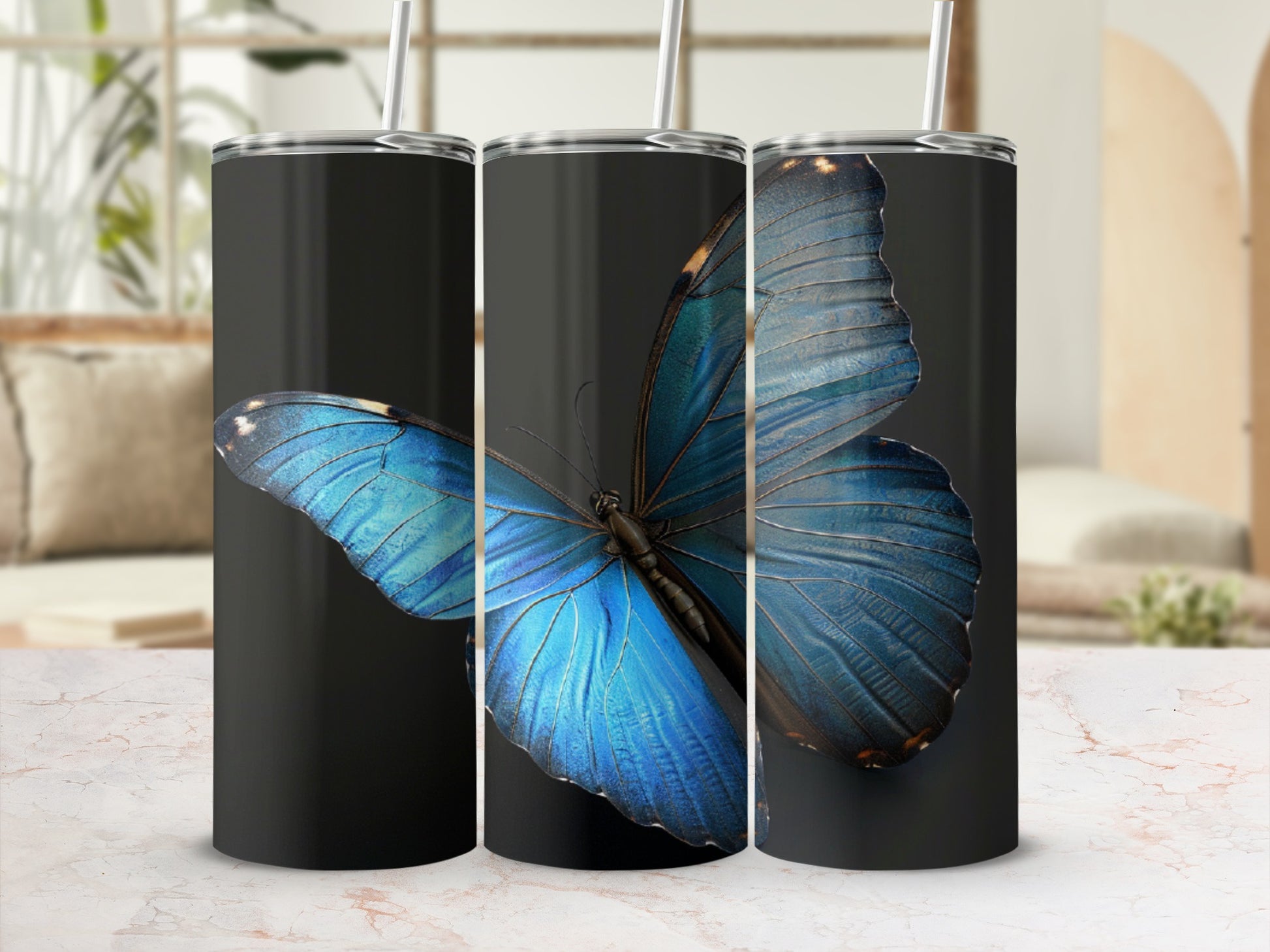 Three black tumblers with a large blue butterfly graphic.