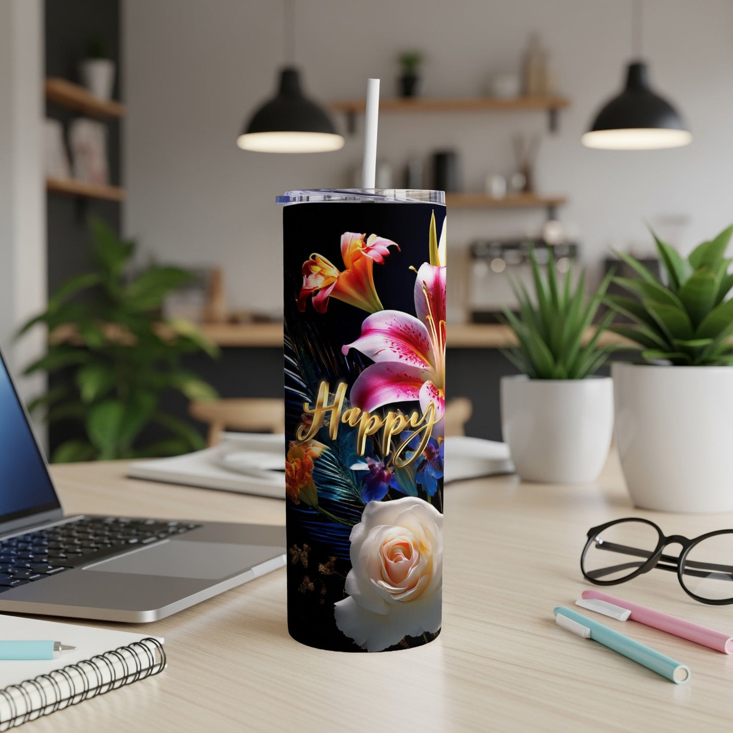 Black tumbler with "Happy" in gold script and floral designs.