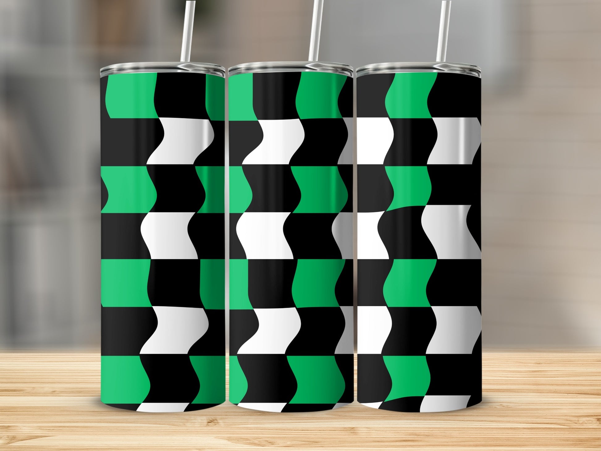 Three tumblers with a black, white, and green checkered wave pattern.