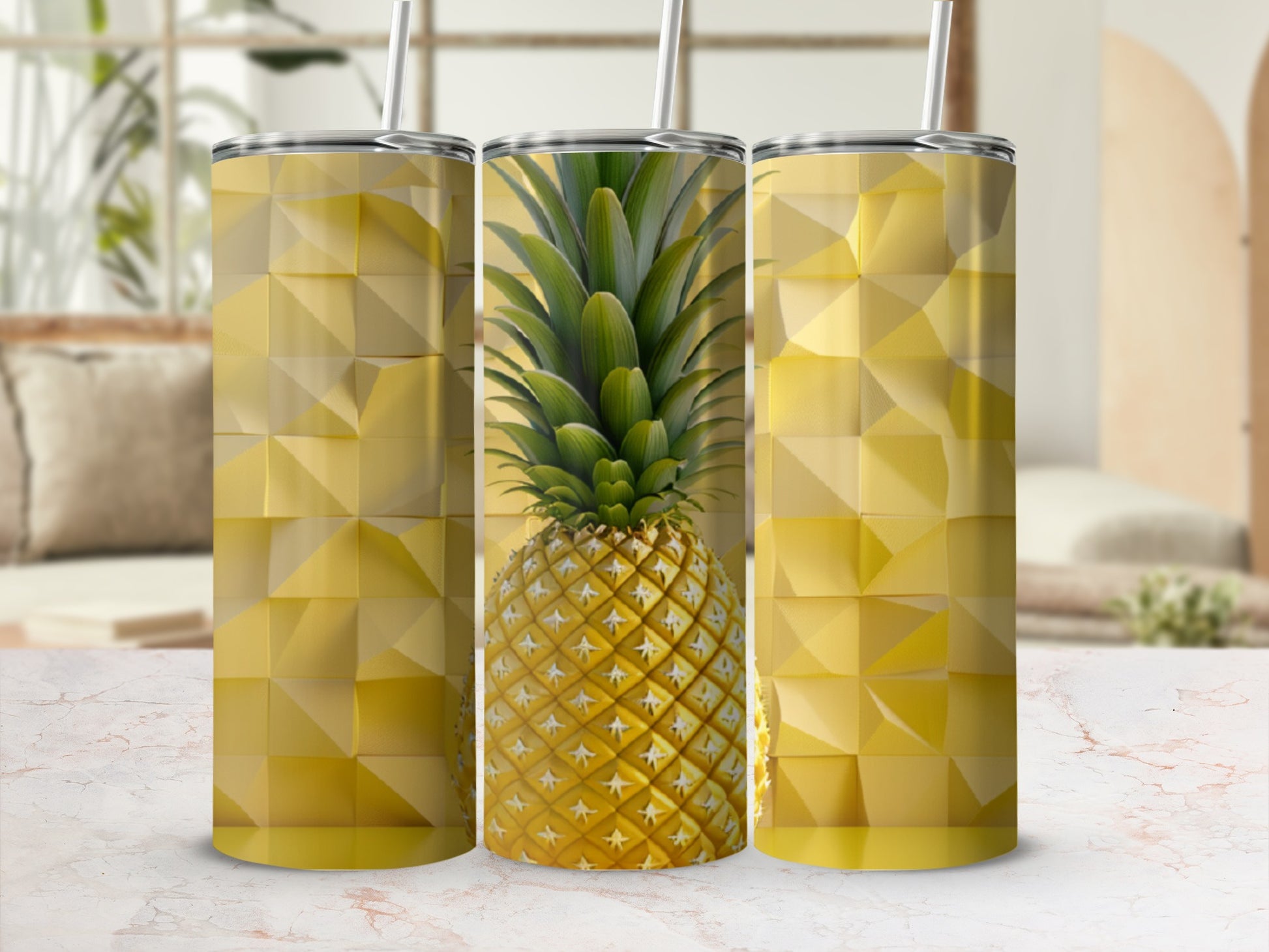 Three tumblers with a pineapple and geometric pattern on a patterned surface.