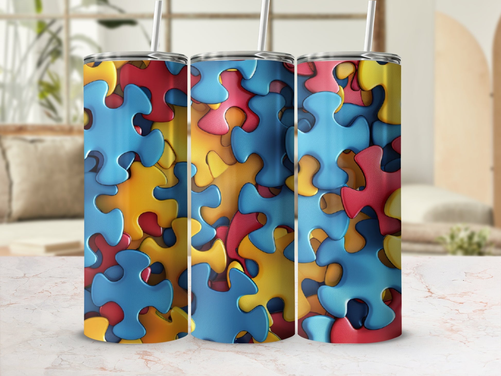 Three tumblers with colorful puzzle piece pattern.