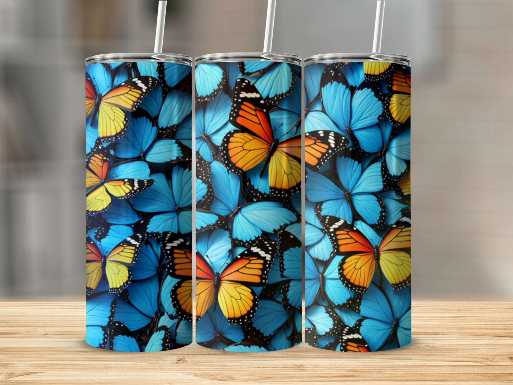 Tumbler with a repeating pattern of colorful blue and orange butterflies.