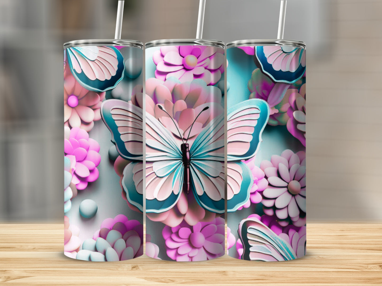 Butterfly and floral patterned tumblers on a wooden surface.