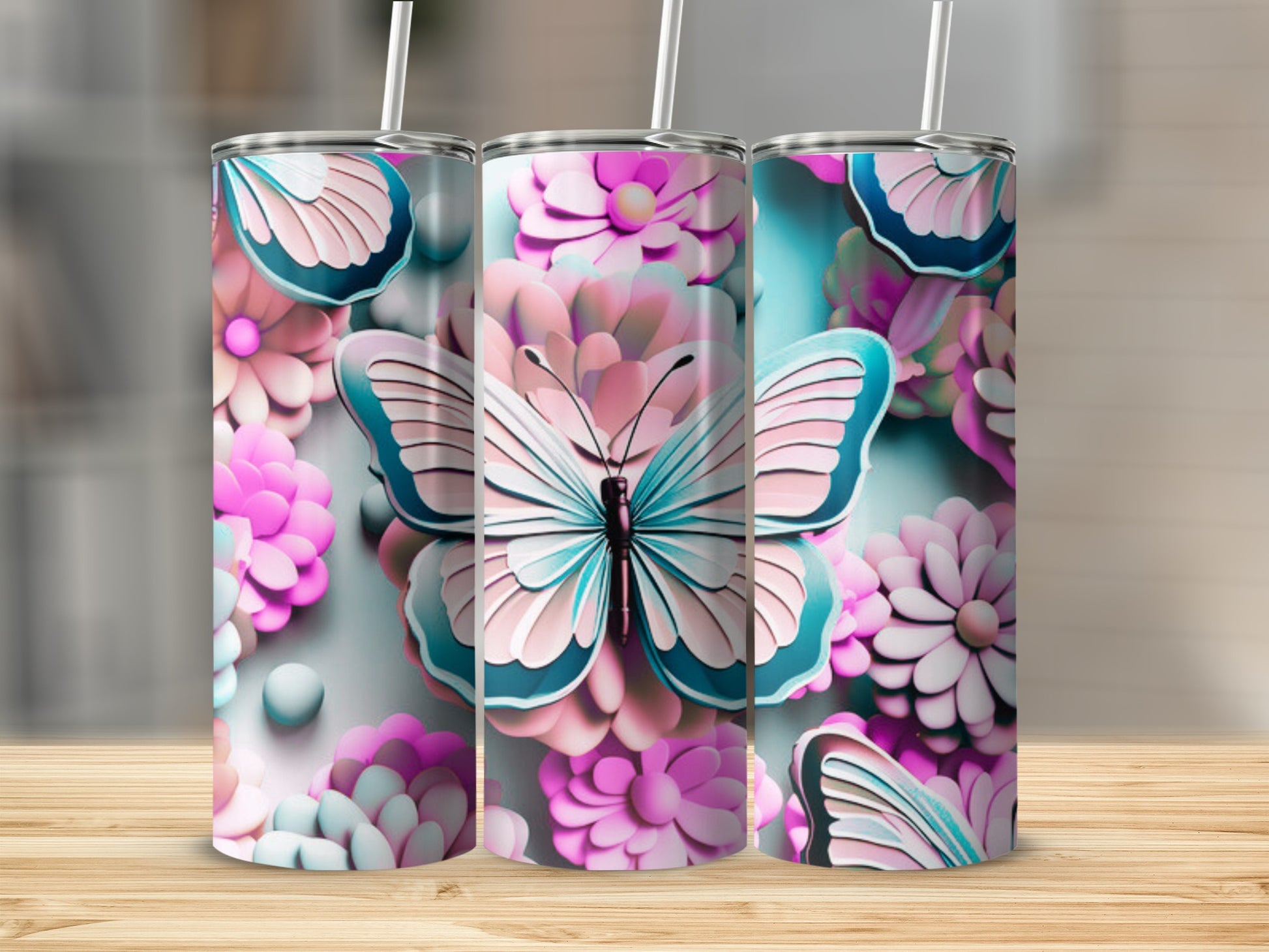 Butterfly and floral patterned tumblers on a wooden surface.