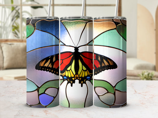 Stained glass tumbler with butterfly design.
