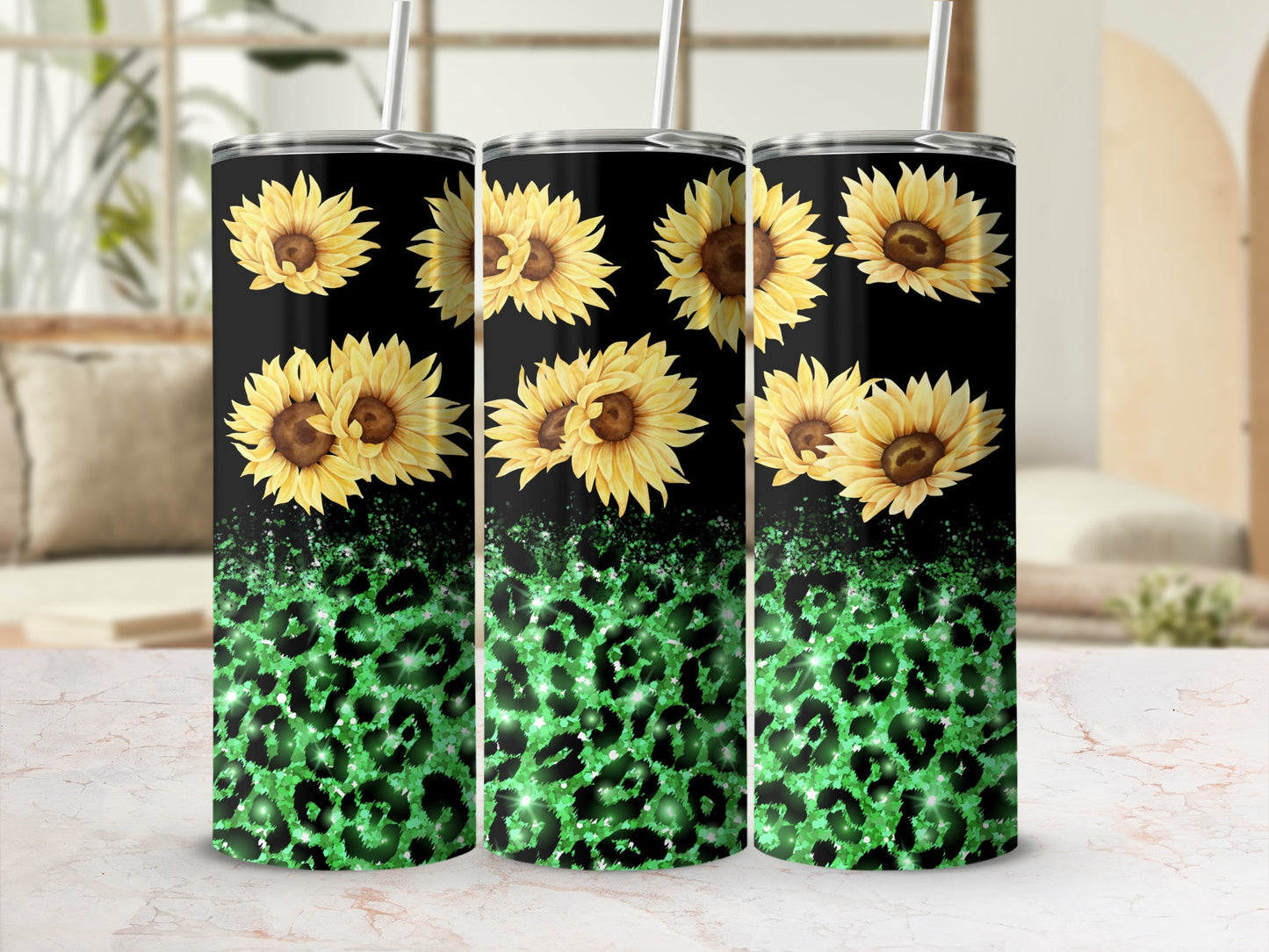 Three tumblers with sunflowers and green leopard print against a black background.