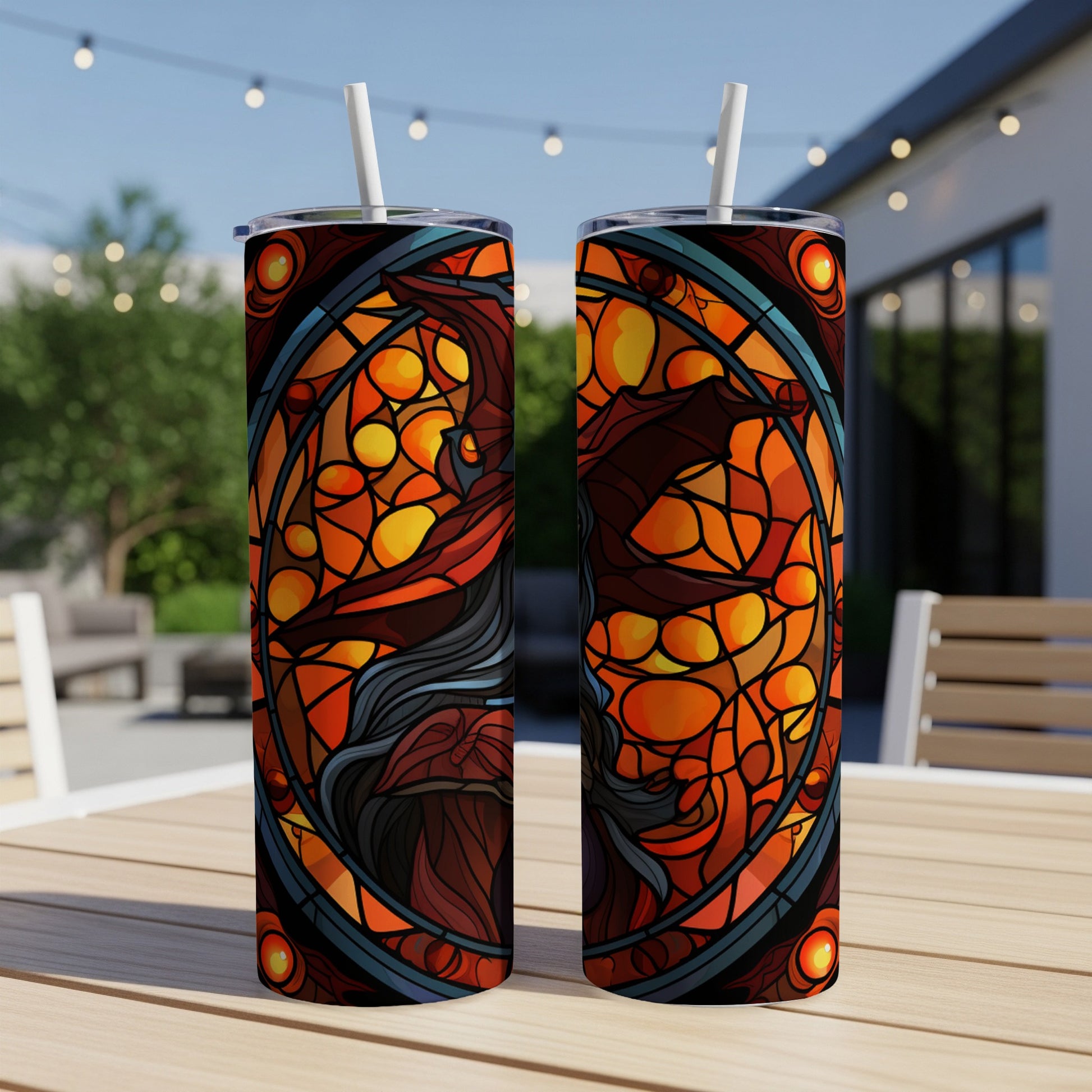 Dragon stained glass design on two tumblers with straws.