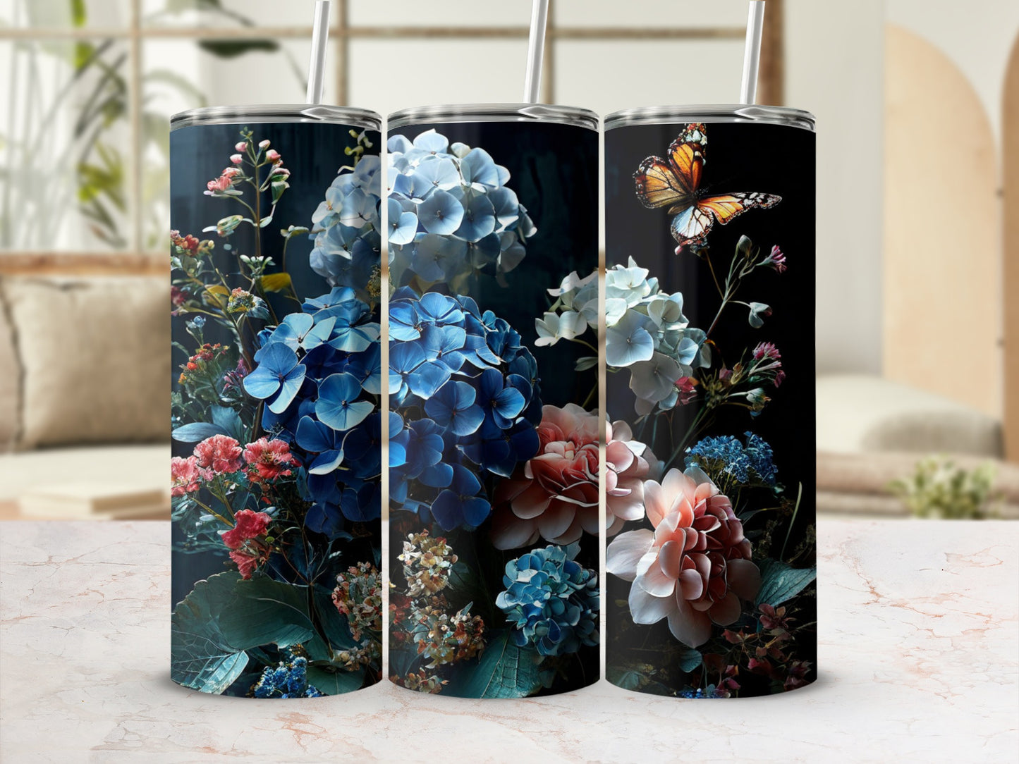 Three tumblers featuring detailed floral designs and a butterfly.