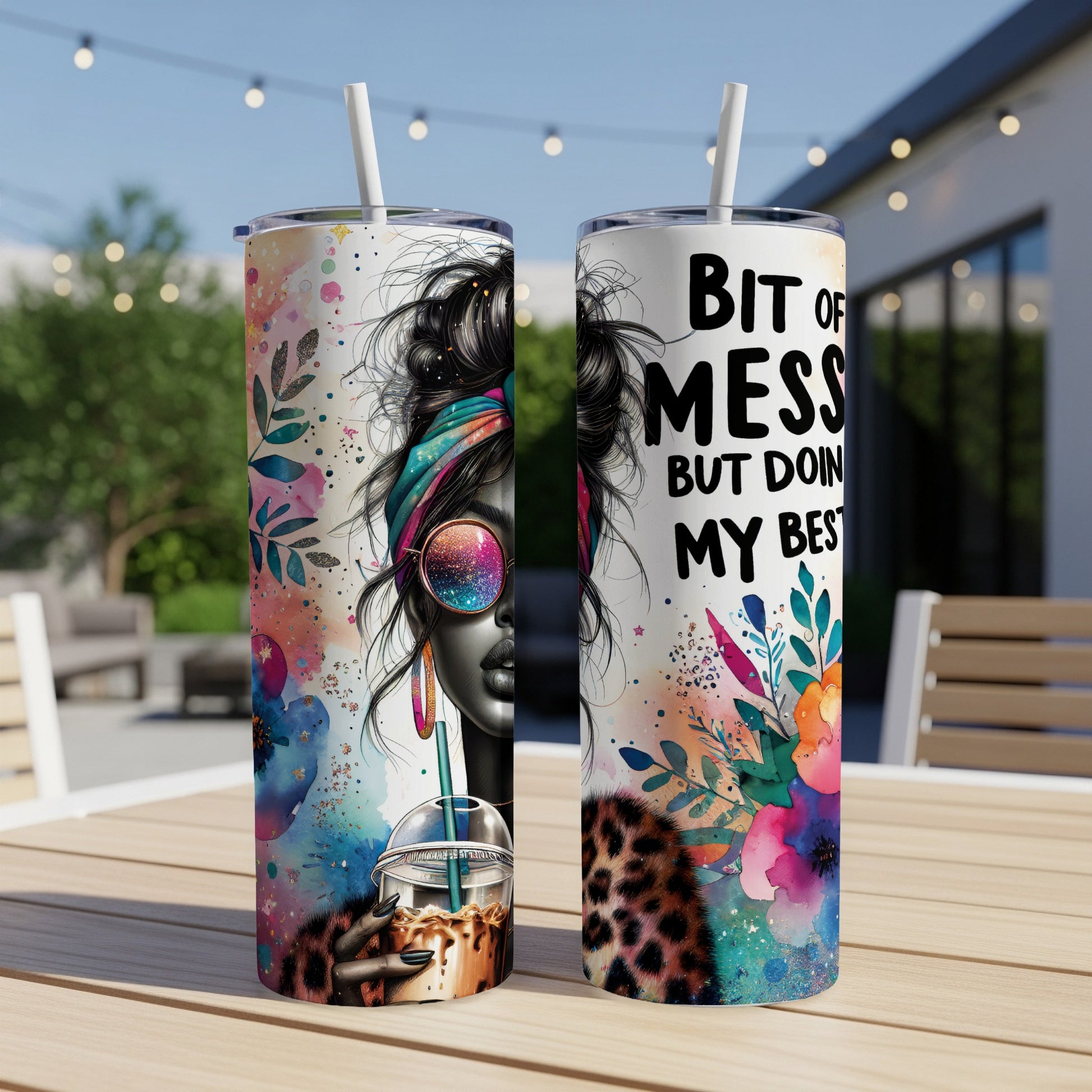 Two tumblers with abstract colorful art and text "Bit of mess but doin my best".