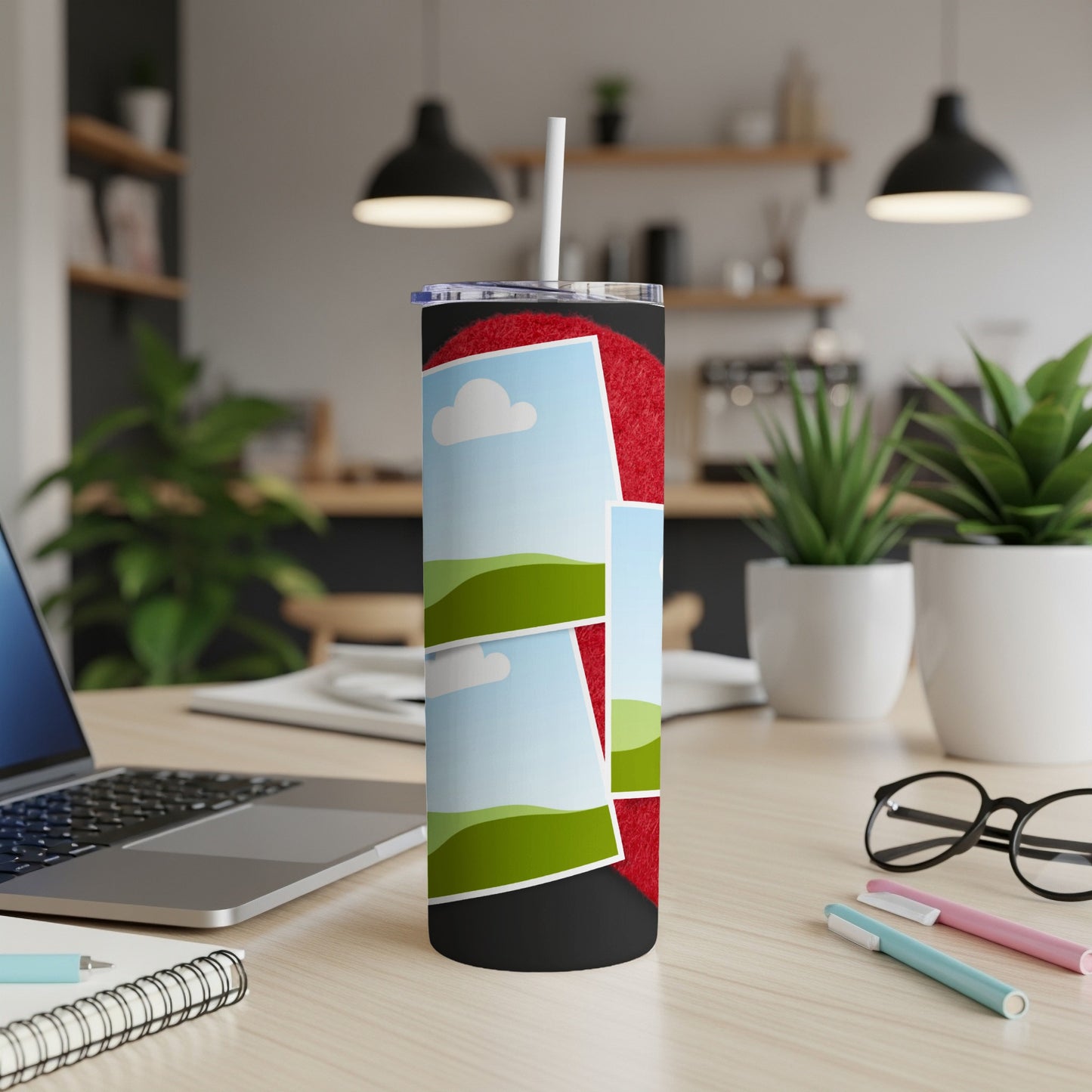 Tumbler with multiple photo frames and a straw on a desk.